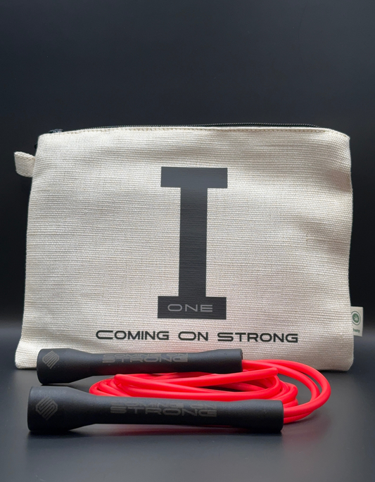 Red Coming On Strong jump rope with tan hemp carry bag and black handles.