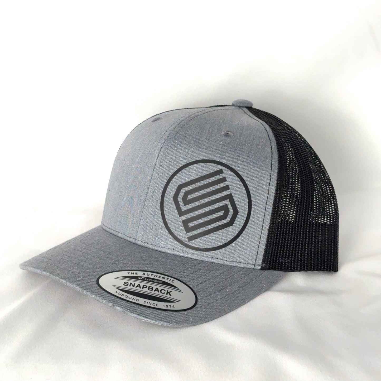 Stylish snapback hat on white background from Coming On Strong. 