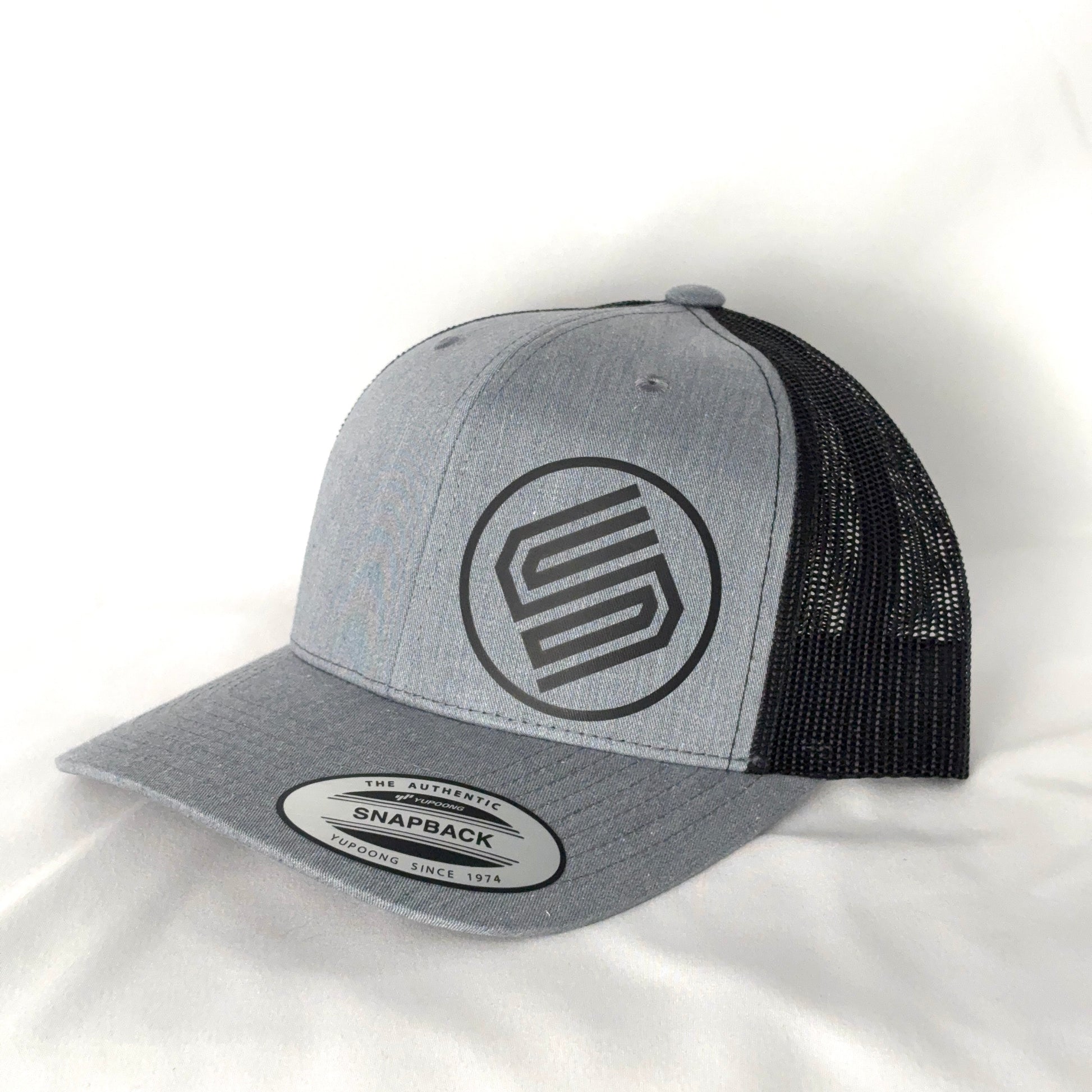 Stylish snapback hat on white background from Coming On Strong. 