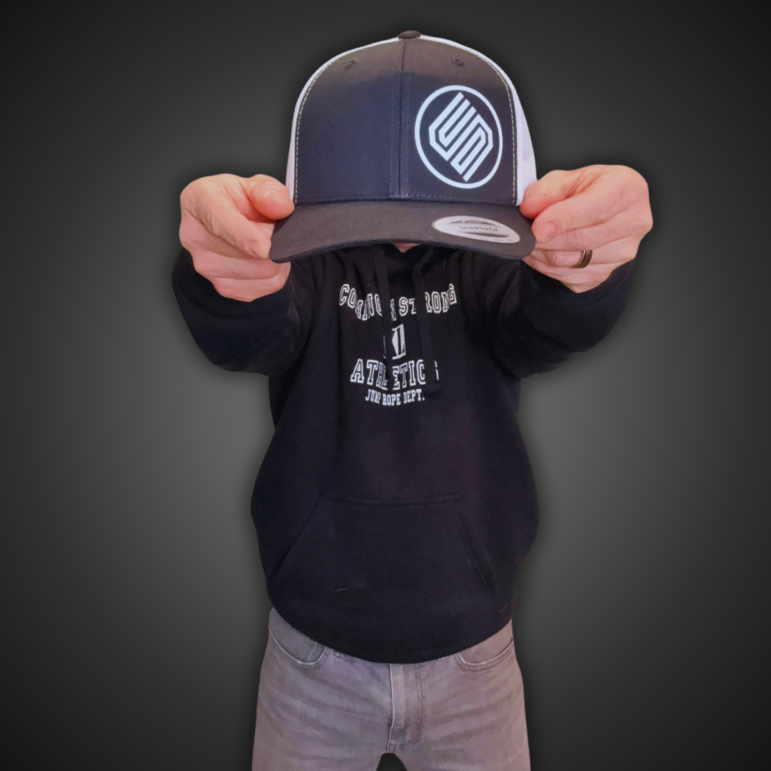 Stylish black and white snapback hat from Coming On Strong for men and women. 
