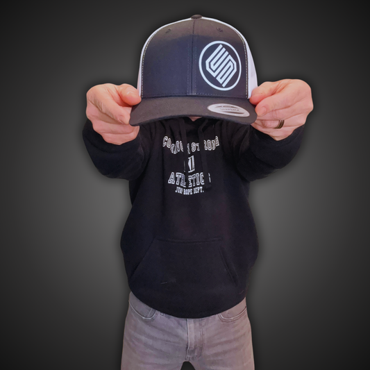 Stylish black and white snapback hat from Coming On Strong for men and women. 