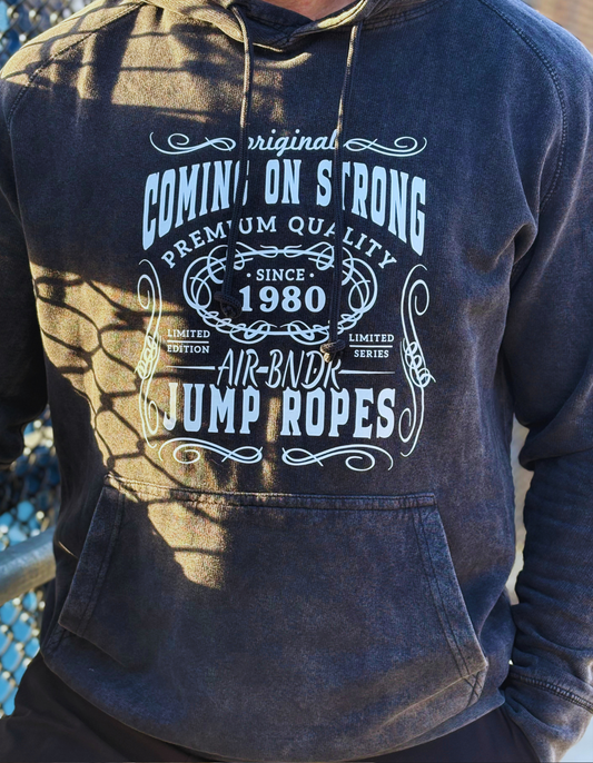 Dan Bantell wearing a distressed Coming On Strong hoodie with vintage print. 
