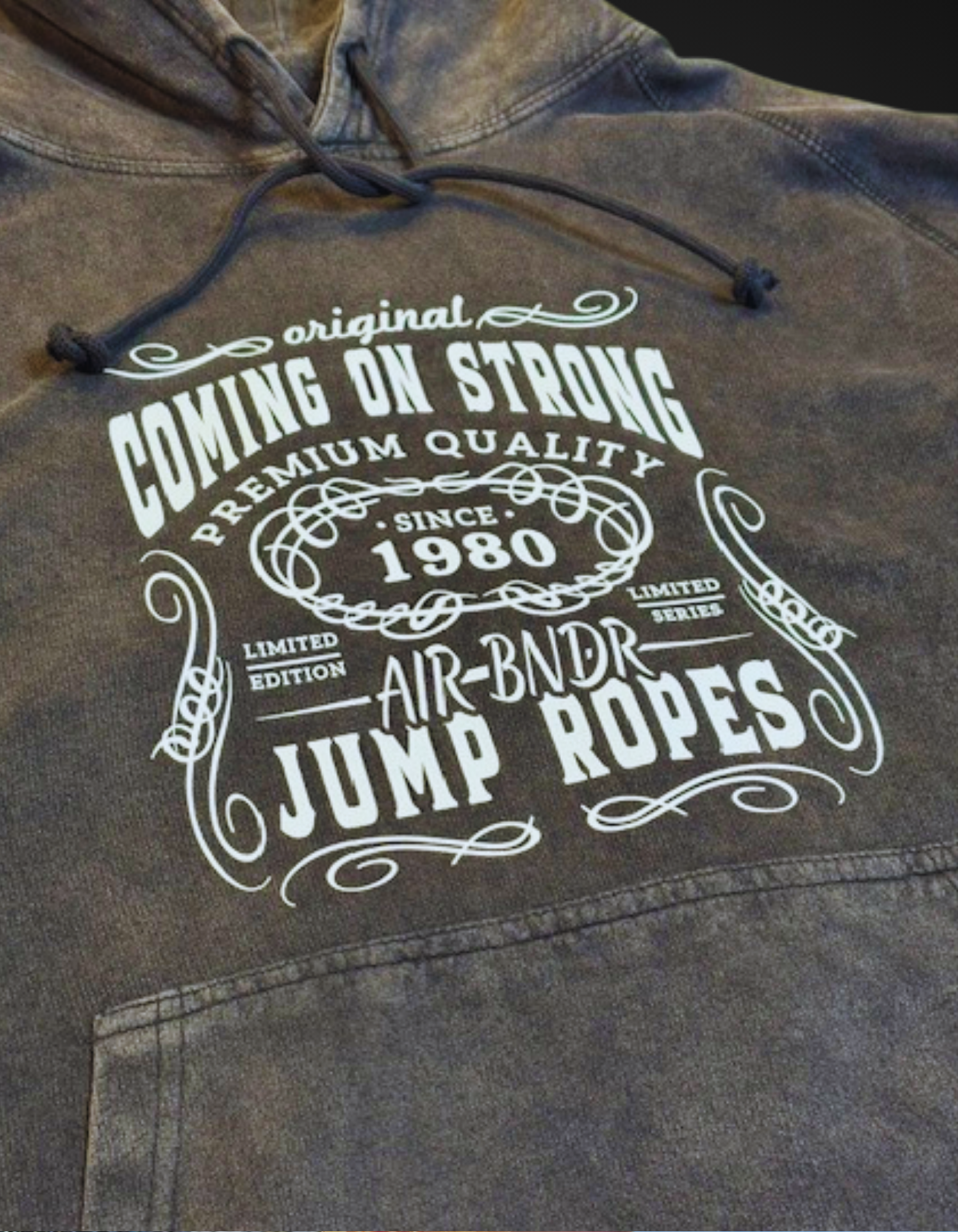 Vintage print on a distressed hoodie on a black background. 